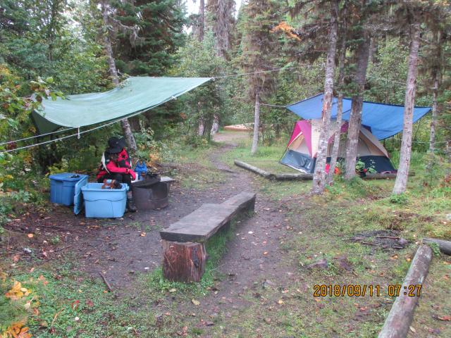 Cook tarp and tent (also tarped) looking back towards the end of the portage